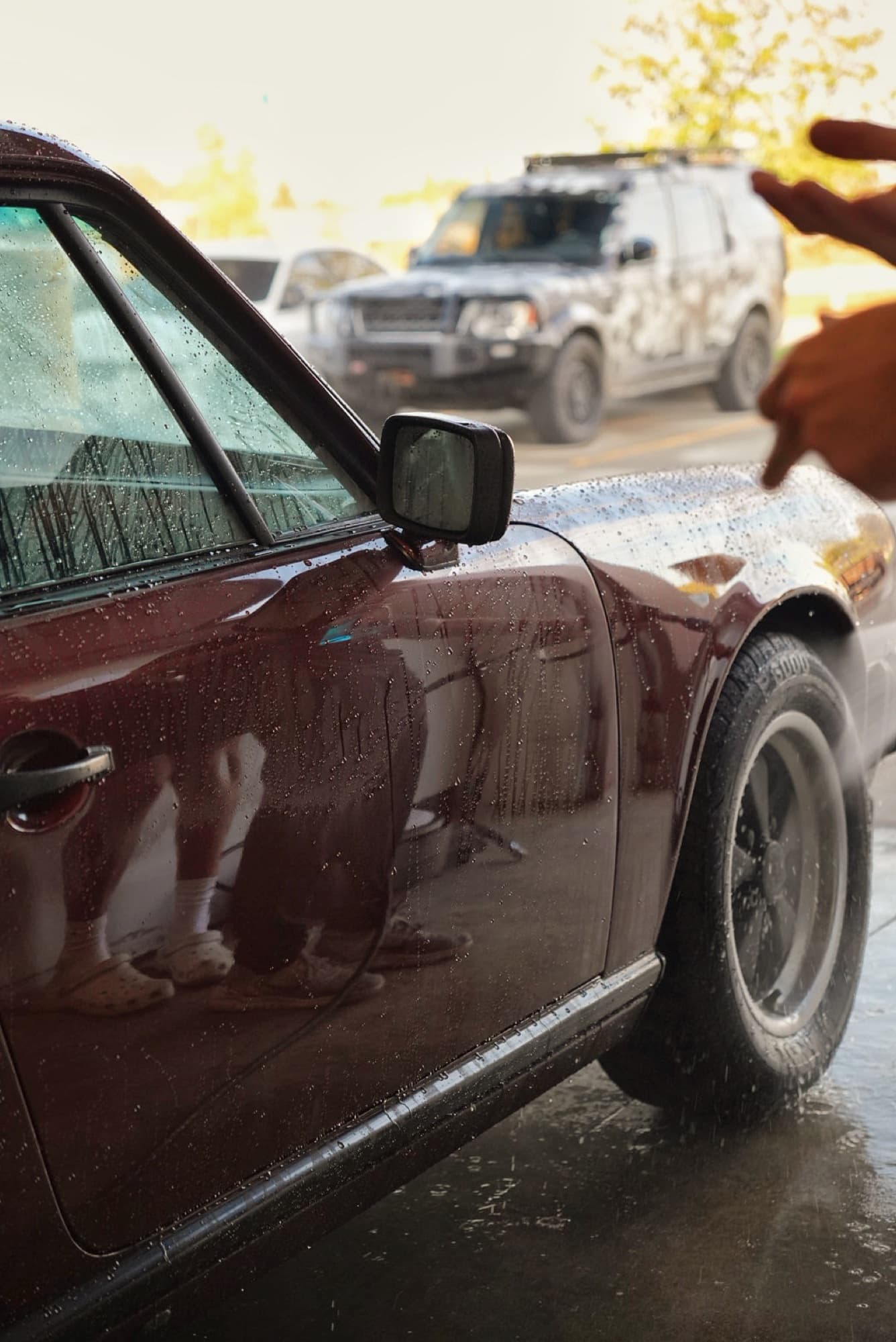 Classic burgundy Porsche 911 mid-wash with foam at Diamond Detailz